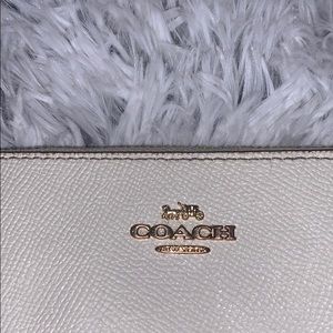 Coach cream/white wristlet